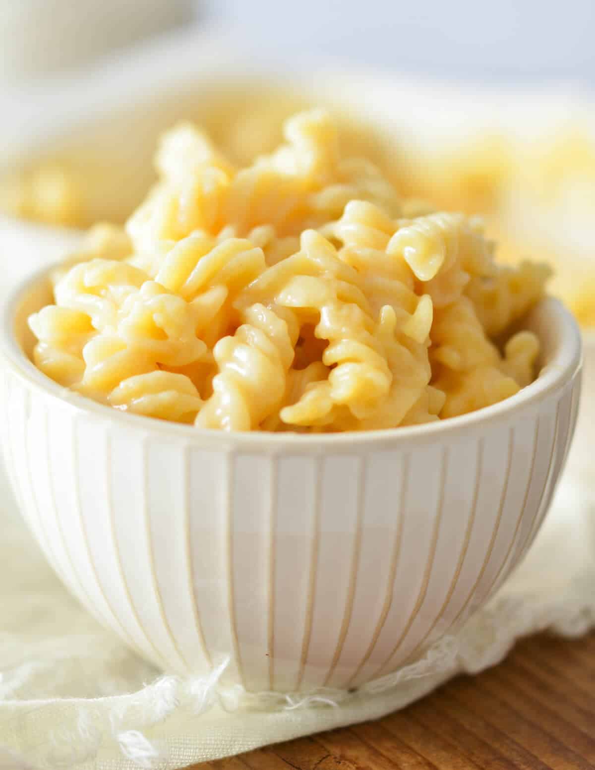 a bowl full of gluten free macaroni and cheese. 