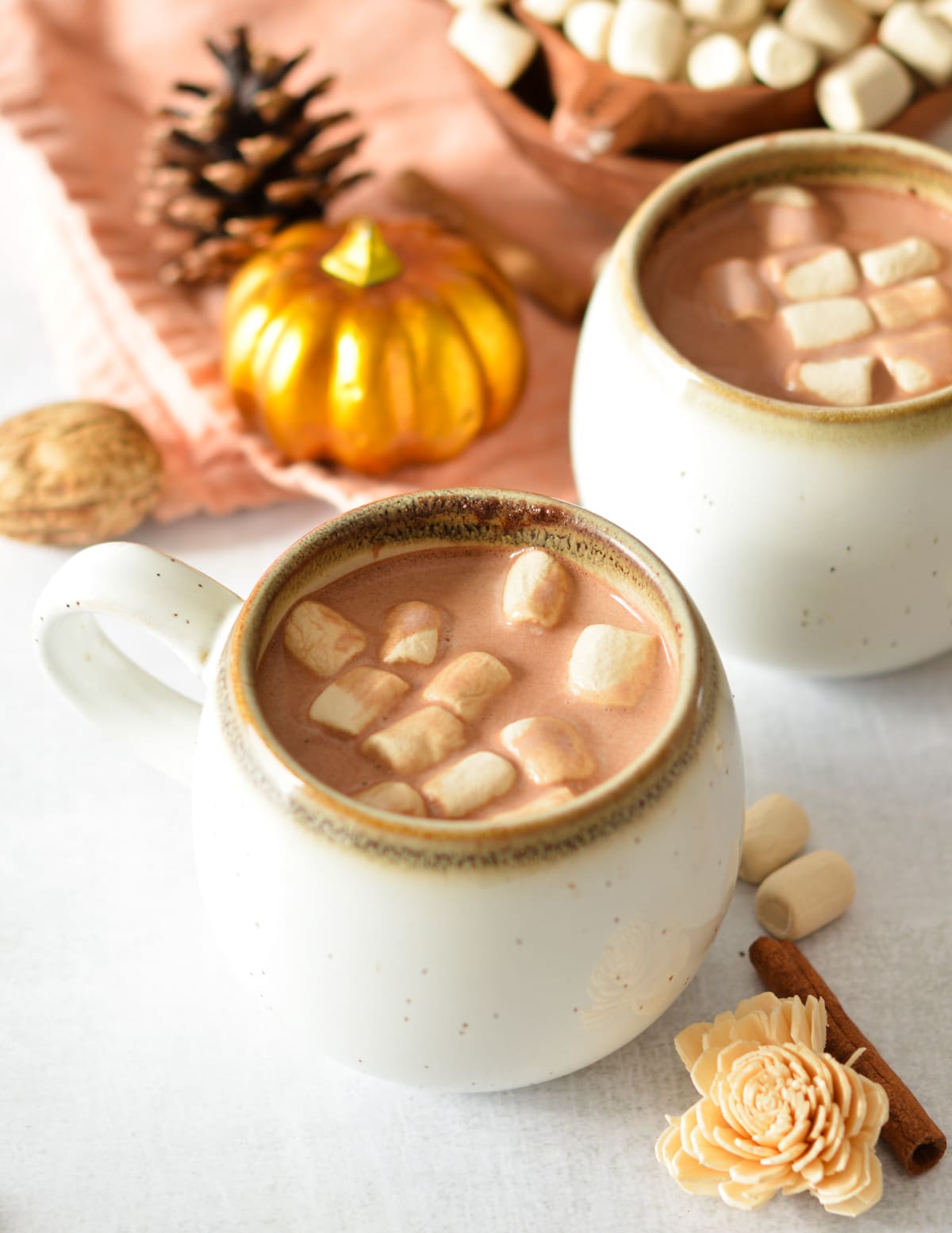 mugs of hot chocolate with maple marshmallows on top. 