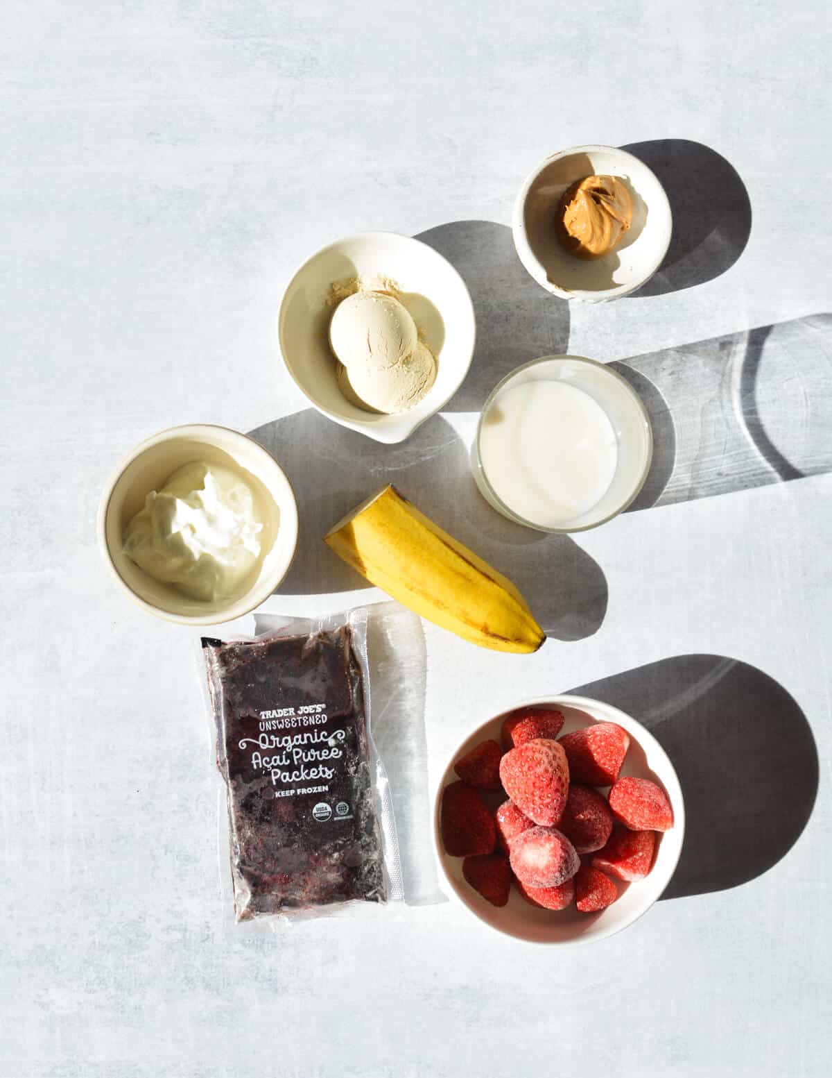 banana, peanut butter, strawberries, acai, protein powder, greek yogurt, almond milk. 